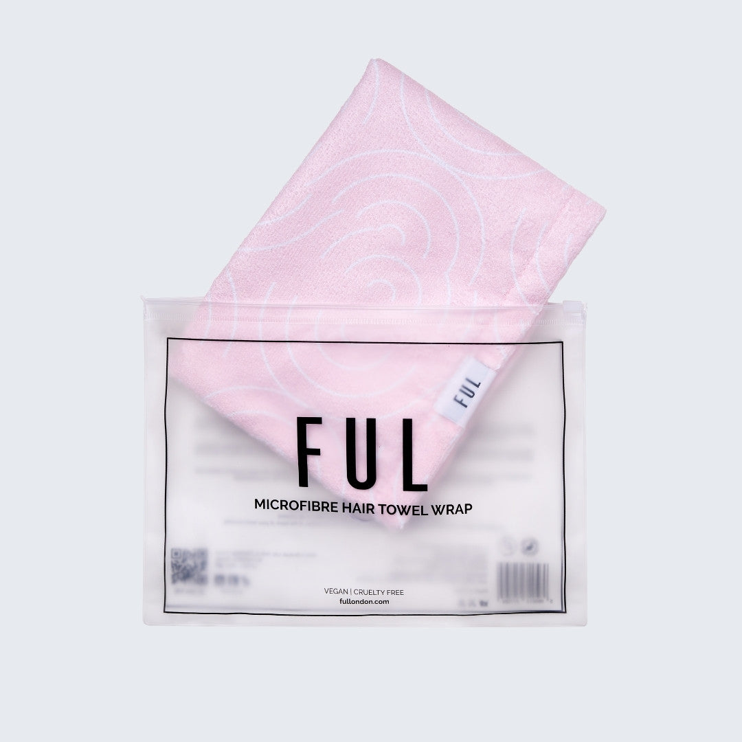 Pink microfiber hair towel wrap with 'FUL' branding on a grey background