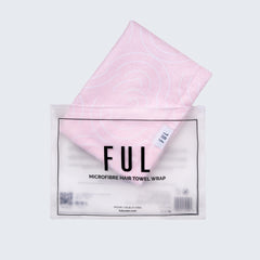Pink microfiber hair towel wrap with 'FUL' branding on a grey background